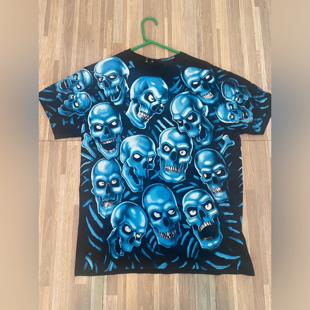 Fire liquid blue shirt - blue skulls that glow in the dark